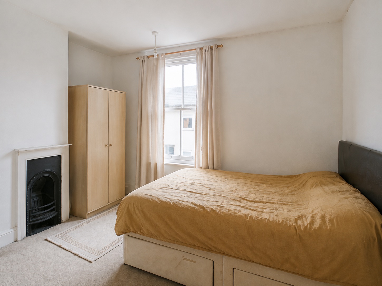 A home office that doubles as a guest room: Before