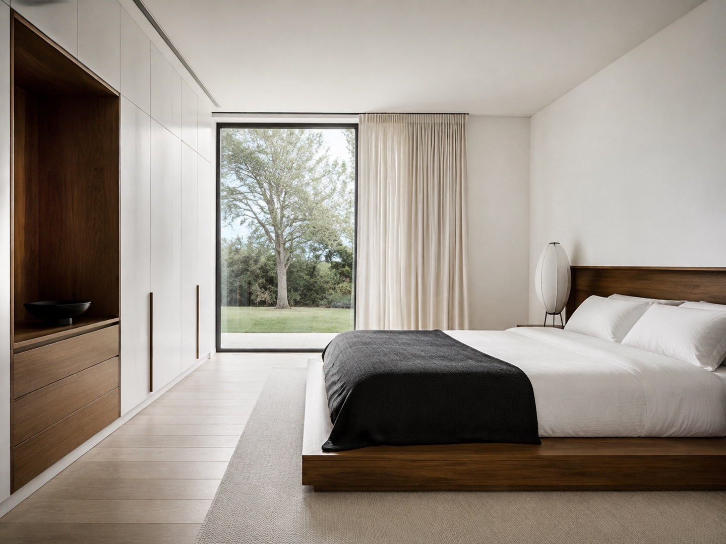 The bed, storage and window carry the composition with little competing decoration.